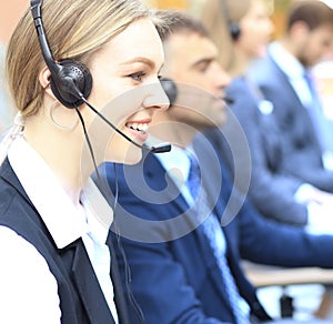 Female customer support operator with headset and smiling