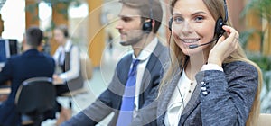 Female customer support operator with headset and smiling