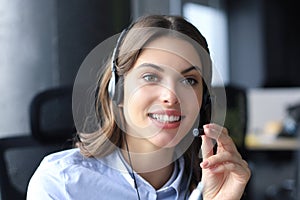 Female customer support operator with headset and smiling