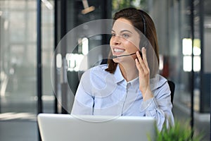 Female customer support operator with headset and smiling