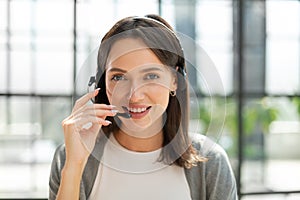 Female customer support operator with headset and smiling