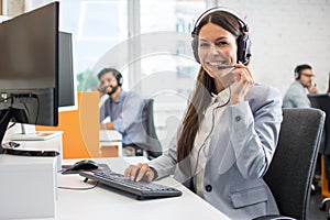 Female customer support operator working in call center. Help and technical support concept.