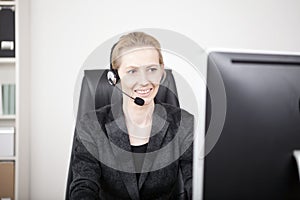 Female Customer Support Sitting at her Office
