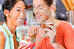 Female customers in Parlor with ice cream cone