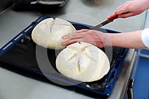 Female cutting dough in a creative manner