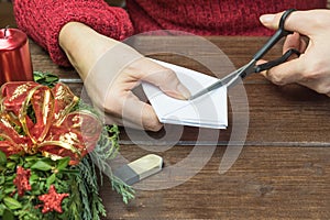 Female is cutting paper tree