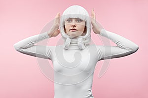 Female cyborg with hands near head