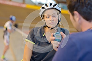 female cycling athlet while competing in olympic velodrome