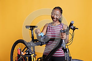 Female cyclist gripping bicycle frame