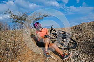 Female cyclist has a mountain bike accident
