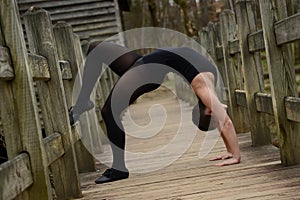 Female Dancer Arching Back on Bridge