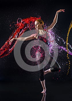 Female Dancer Being Splashed with Colorful Water