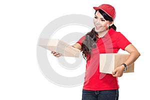 Female delivery service happily delivering package to costumer