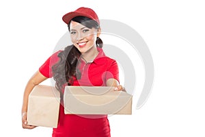 Female delivery service happily delivering package to costumer