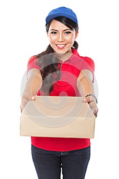 Female delivery service happily delivering package to costumer