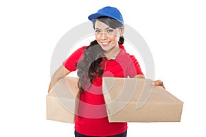 Female delivery service happily delivering package to costumer