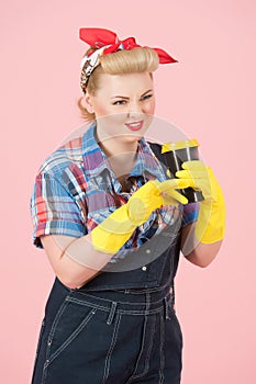 Female in denim and pin-up hair dress and make up with coffee. Take away coffee for working girl