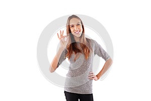 Female denoting approval with ok sign isolated over white background