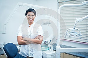 Female dentist with arms crossed