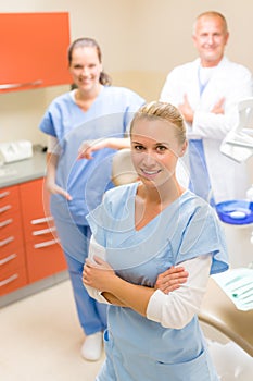 Female dentist with colleagues