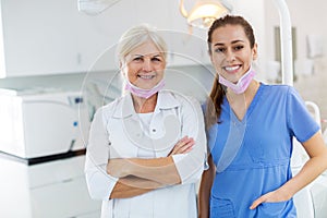 Female dentist and dental assistant in office