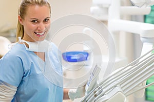 Female dentist with dental equipment at surgery