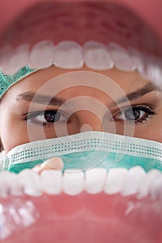Female dentist examining teeth.