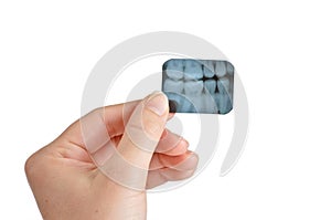 Female Dentist Holds X-Ray photo
