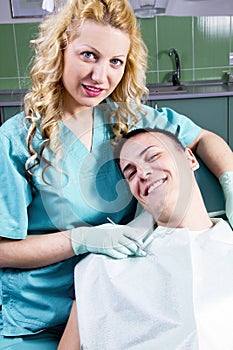 Female dentist with satisfied client