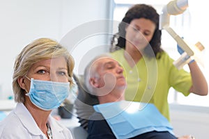 female dentist standing in office