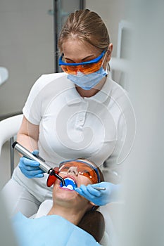 Female dentist taking care of patient stock photo