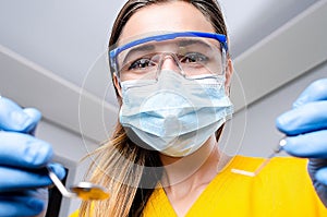 Female Dentist With Tools