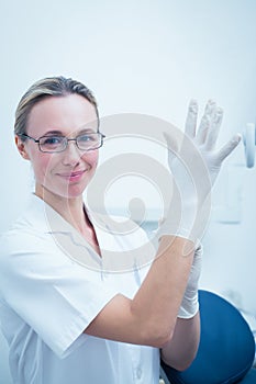 Female dentist wearing surgical glove