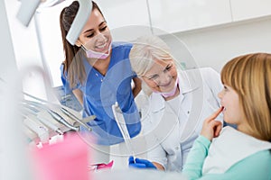 Female dentists and child in a dentist office