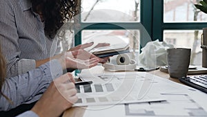 Female design engineers discussing some project in the office.