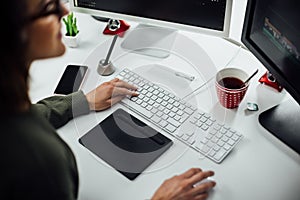 Female designer hands working in her work space with a pen tablet