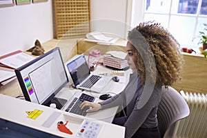 Female Designer Operating CAD System For Laser Cutter
