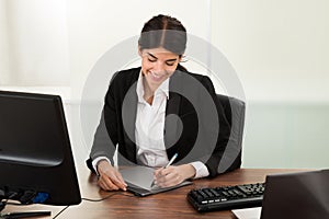 Female designer using graphic tablet