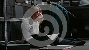 Female detective reading records on criminal case