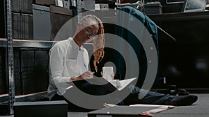 Female detective reading records on criminal case