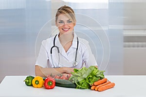 Female dietician with vegetables photo