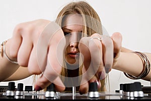 Female DJ adjusting sound levels