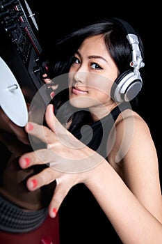 Female DJ mixing on turntables