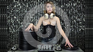 Female dj with pile of vinyl records, stop motion