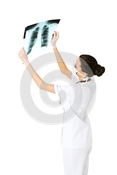 Female doctor analysing x-ray image