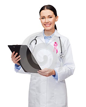 Female doctor with breast cancer awareness ribbon