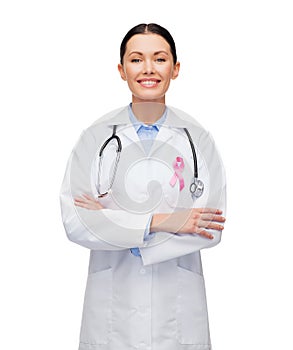 Female doctor with breast cancer awareness ribbon