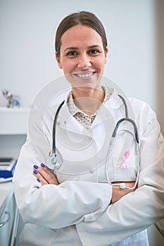 Doctor with breast cancer awareness ribbon