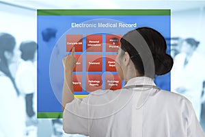 Female doctor choose working item from electronic medical record