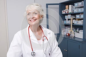 Female Doctor At Clinic With Stethoscope Around Neck